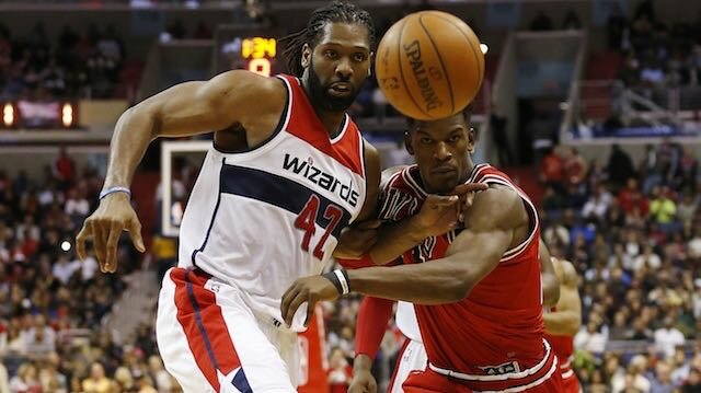 Washington Wizards forward Nene (left)) and Chicago Bulls guard Jimmy Butler (21) battle for a loose ball in the fourth quarter at Verizon Center. The Wizards won 102-86. (Geoff Burke-USA TODAY Sports)