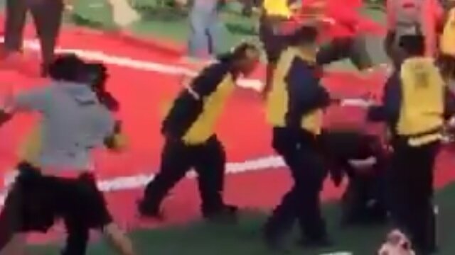 Watch Security Guard at AAC Championship Game Assault Fan Storming Field