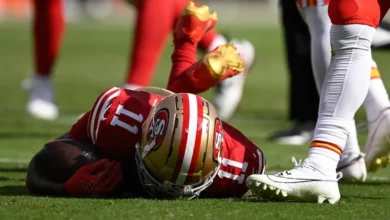 NFL Player falling to the ground