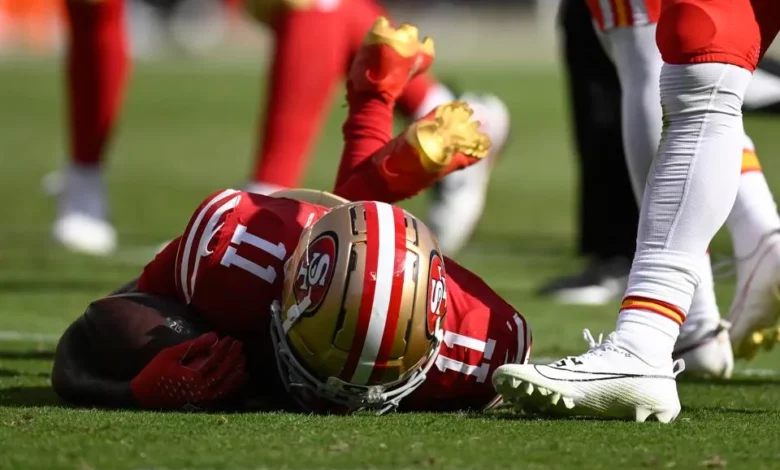 NFL Player falling to the ground