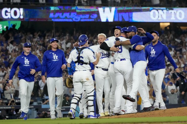 The Los Angeles Dodgers celebrate on the mound